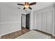 Bedroom with a ceiling fan and closet space at 2700 Oak Hammock Loop, Mulberry, FL 33860