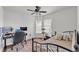Bedroom features desk area, natural light, and ceiling fan at 2700 Oak Hammock Loop, Mulberry, FL 33860