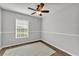 Bright bedroom with a ceiling fan and natural light at 2700 Oak Hammock Loop, Mulberry, FL 33860