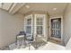 Inviting front porch with seating, offering a cozy spot to relax and enjoy the neighborhood views at 2700 Oak Hammock Loop, Mulberry, FL 33860
