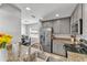 Bright kitchen with stainless appliances, granite counters, and open access to the breakfast nook at 2700 Oak Hammock Loop, Mulberry, FL 33860