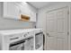 Laundry room with front-loading washer and dryer at 2700 Oak Hammock Loop, Mulberry, FL 33860