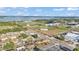 An aerial view showcasing neighborhood homes, baseball fields, a stadium, and a large lake at 2705 N Martha Ave, Lakeland, FL 33805