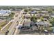 An aerial view of the home and street that highlights nearby shops and businesses at 2705 N Martha Ave, Lakeland, FL 33805