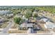 An aerial view of the neighborhood showcasing a fenced yard with a pool and a play area at 2705 N Martha Ave, Lakeland, FL 33805
