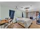 Comfortable bedroom featuring a brick fireplace, wood floors, a sewing machine and a modern ceiling fan at 2705 N Martha Ave, Lakeland, FL 33805