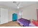 Cozy bedroom featuring a pink canopy bed and colorful decor at 2705 N Martha Ave, Lakeland, FL 33805
