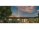 Charming, green single-story home with a welcoming front porch and landscaped yard at 2705 N Martha Ave, Lakeland, FL 33805