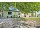 View of home with mature tree in yard at 2705 N Martha Ave, Lakeland, FL 33805