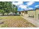 Well-maintained front yard with green grass leading to a charming single-story home at 2705 N Martha Ave, Lakeland, FL 33805