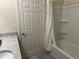 Well-lit bathroom featuring a vanity with solid surface countertop and a shower-tub combo at 297 Spirit Landings Cir, Winter Haven, FL 33880