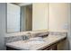 Bathroom featuring granite countertops, a sink, and a large mirror at 297 Spirit Landings Cir, Winter Haven, FL 33880