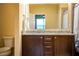 Bathroom displaying a large mirror, granite countertops, and a toilet at 297 Spirit Landings Cir, Winter Haven, FL 33880