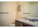 Bathroom showcasing granite countertops, a sink, and a toilet at 297 Spirit Landings Cir, Winter Haven, FL 33880
