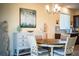 Coastal dining room with table and chairs, sideboard and stylish décor at 297 Spirit Landings Cir, Winter Haven, FL 33880