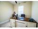 Bright office with a desk, chair, and natural light at 297 Spirit Landings Cir, Winter Haven, FL 33880