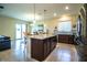 Spacious kitchen with large island, stainless appliances, and open layout at 297 Spirit Landings Cir, Winter Haven, FL 33880