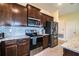 View of a modern kitchen with stainless steel appliances, granite countertops and subway tile backsplash at 297 Spirit Landings Cir, Winter Haven, FL 33880