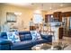 Living room with open layout to kitchen and dining area with sofa and stylish décor at 297 Spirit Landings Cir, Winter Haven, FL 33880