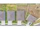 Aerial view of houses with well-manicured lawns and paved driveways in a suburban neighborhood at 2991 Flying Blackbird Rd, Bartow, FL 33830