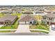 This single-story home features a 2-car garage, manicured lawn, and inviting entryway, nestled in a well-planned neighborhood at 2991 Flying Blackbird Rd, Bartow, FL 33830