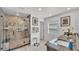 Bathroom features a glass shower with tiled walls, granite counters, modern fixtures, and a bright window at 2991 Flying Blackbird Rd, Bartow, FL 33830