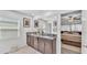Bathroom features granite counters, modern sinks, large mirror, and access to the ensuite bedroom at 2991 Flying Blackbird Rd, Bartow, FL 33830