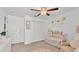 Bright Bedroom with crib, fan, and decor at 2991 Flying Blackbird Rd, Bartow, FL 33830