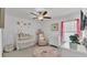 Bright Bedroom with crib, changing table, and decor at 2991 Flying Blackbird Rd, Bartow, FL 33830