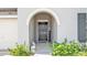 Inviting front porch with decorative accents leads to a stylish front door, enhancing curb appeal at 2991 Flying Blackbird Rd, Bartow, FL 33830