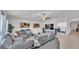 Relaxing living area with modern decor, a large television, and ample natural light at 2991 Flying Blackbird Rd, Bartow, FL 33830