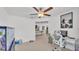 Well-lit office space with modern furniture, aquarium, and an open view to the living and dining areas at 2991 Flying Blackbird Rd, Bartow, FL 33830