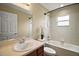 Bathroom featuring a tub and shower combination, single sink vanity, and neutral decor at 305 Woods Landing Dr, Lady Lake, FL 32159