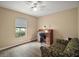 Bedroom with a desk, chair, and a love seat at 305 Woods Landing Dr, Lady Lake, FL 32159