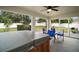 Covered outdoor lanai featuring hot tub and access to a private, fenced backyard at 305 Woods Landing Dr, Lady Lake, FL 32159