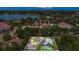 Aerial view outlining property featuring solar panels, pool, and established landscaping at 317 S 8Th St, Haines City, FL 33844