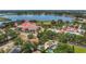 Beautiful aerial view of a community center with a water park, lake, and lush landscaping at 317 S 8Th St, Haines City, FL 33844