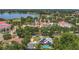 Aerial view of Haines City neighborhood featuring community waterpark and home with pool at 317 S 8Th St, Haines City, FL 33844