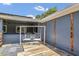 Back patio swing with exterior paneling and roof overhang at 317 S 8Th St, Haines City, FL 33844