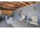Cozy back patio with exposed wood beam ceiling, seating, and view of spa at 317 S 8Th St, Haines City, FL 33844