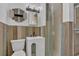 Charming bathroom with a modern vanity, decorative mirror, and convenient walk-in shower at 317 S 8Th St, Haines City, FL 33844