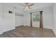 Bright bedroom with modern vinyl floors, ceiling fan, closet and large window offering outdoor views at 317 S 8Th St, Haines City, FL 33844