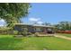 Attractive home with a lush green lawn and vibrant landscaping, presenting a welcoming and well-maintained exterior at 317 S 8Th St, Haines City, FL 33844