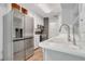 Modern kitchen equipped with stainless steel appliances and features white cabinets, sink and fixtures at 317 S 8Th St, Haines City, FL 33844