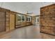 Spacious living room featuring wood plank accent walls, modern flooring, and abundant natural light at 317 S 8Th St, Haines City, FL 33844