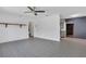 Spacious living room featuring tile floors, neutral walls and a ceiling fan at 317 S 8Th St, Haines City, FL 33844