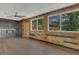 Unique living room featuring wood plank accent walls, modern flooring, and a custom bar area at 317 S 8Th St, Haines City, FL 33844