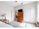 Bedroom with dresser, side table, lamp, and doorway to another room at 3281 Enclave Blvd, Mulberry, FL 33860