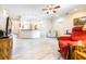 Open-concept living area featuring new light gray floors and plenty of natural light at 3281 Enclave Blvd, Mulberry, FL 33860