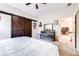 Spacious main bedroom featuring rustic sliding barn doors and soft carpet at 3281 Enclave Blvd, Mulberry, FL 33860